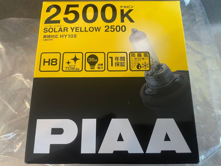 PIAA 22-13408 Solar Yellow H8 light bulb, 2500K, 12V 35W, 2-pack, enhances visibility in foggy conditions with bright yellow light.