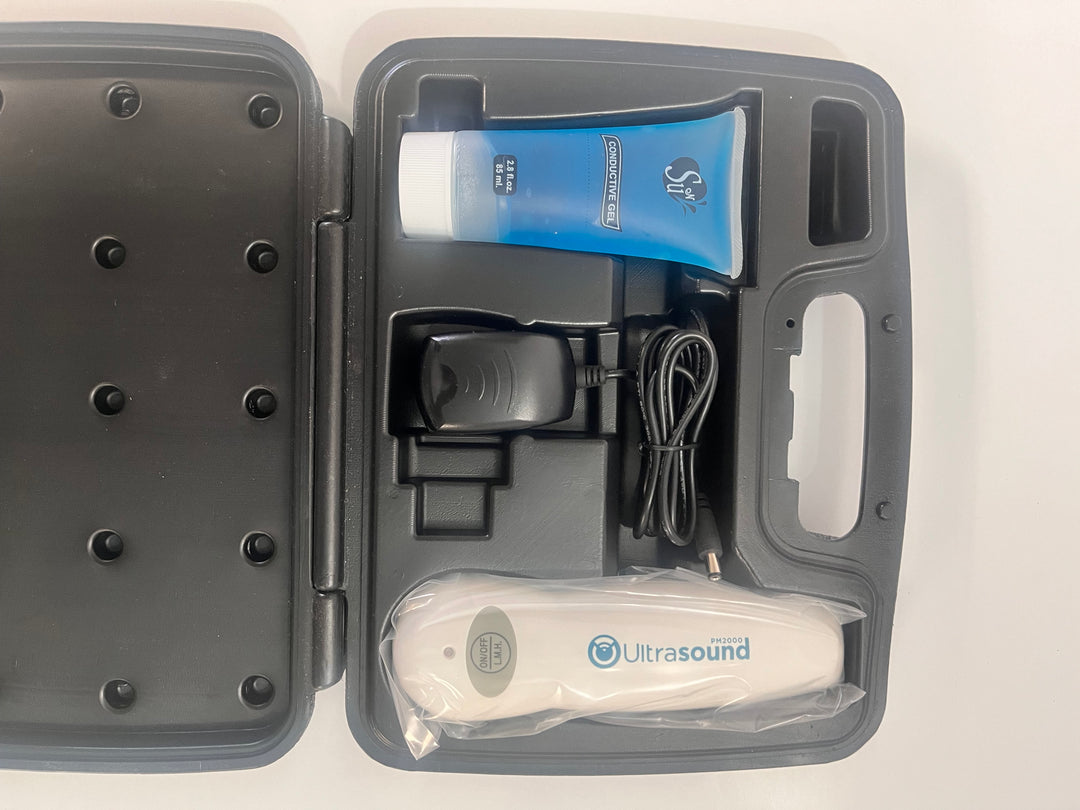 Portable Ultrasound PM 2000 device with AC adapter, gel, and carrying case.