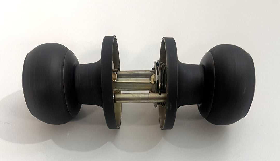 Oil-rubbed bronze Probrico privacy door knob handle with a classic round design for interior doors.