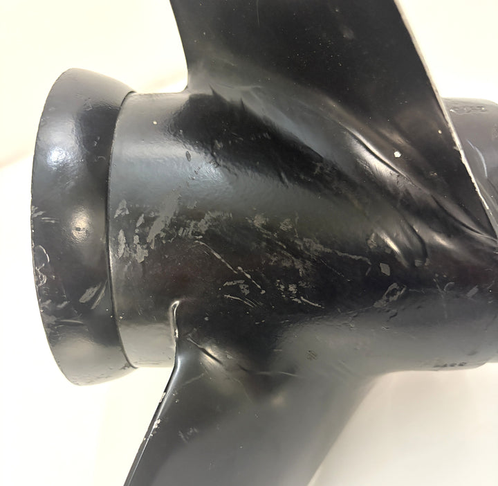 Close-up of a black aluminum propeller with visible wear marks and a 19-spline drive hub, designed for Volvo marine engines.