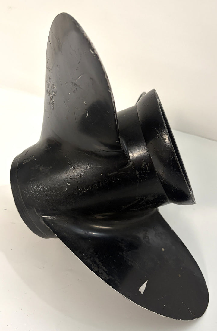 Black aluminum marine propeller with three blades, showing surface wear and a 19-spline hub, photographed against a plain white background.