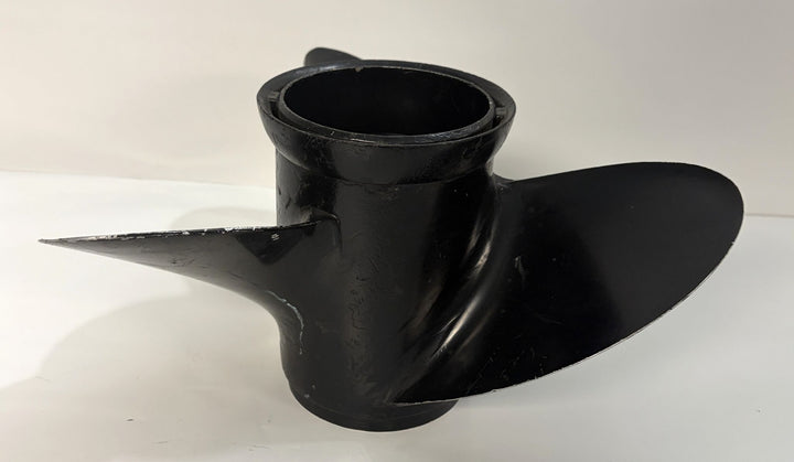 Used black aluminum marine propeller with two blades and smooth curved surfaces, featuring a clean central hub compatible with Volvo applications.