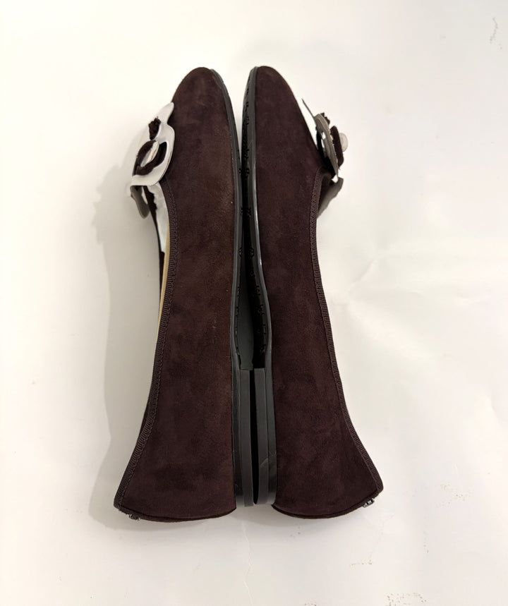 Pair of Sam Edelman chocolate brown suede ballet flats with slip-on design and decorative bow detail, photographed on a plain white background.