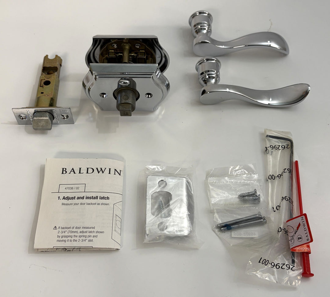 Baldwin privacy door lever set with curved chrome handles, latch mechanism, screws, installation instructions, and additional small hardware pieces displayed on a white background.