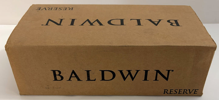 Brown cardboard box labeled Baldwin Reserve containing a premium Baldwin door lever product for home or industrial use