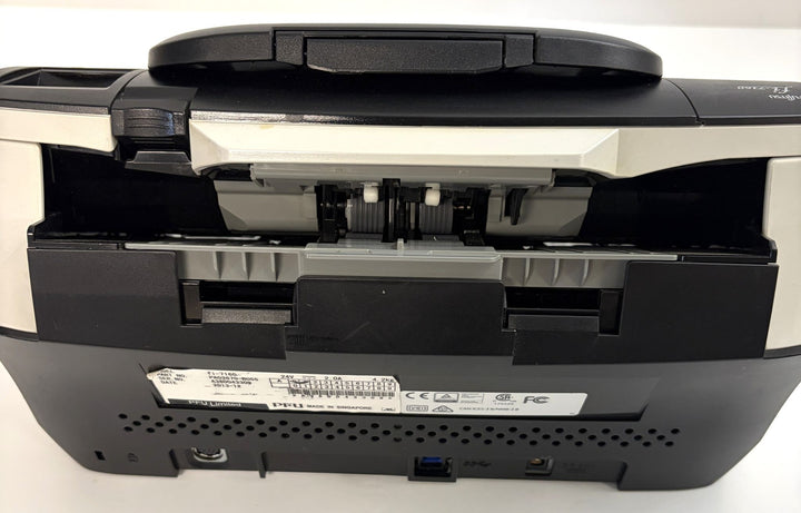 Fujitsu fi-7160 duplex document scanner in black and white with rear paper feed path and identification label, sold for parts or repair