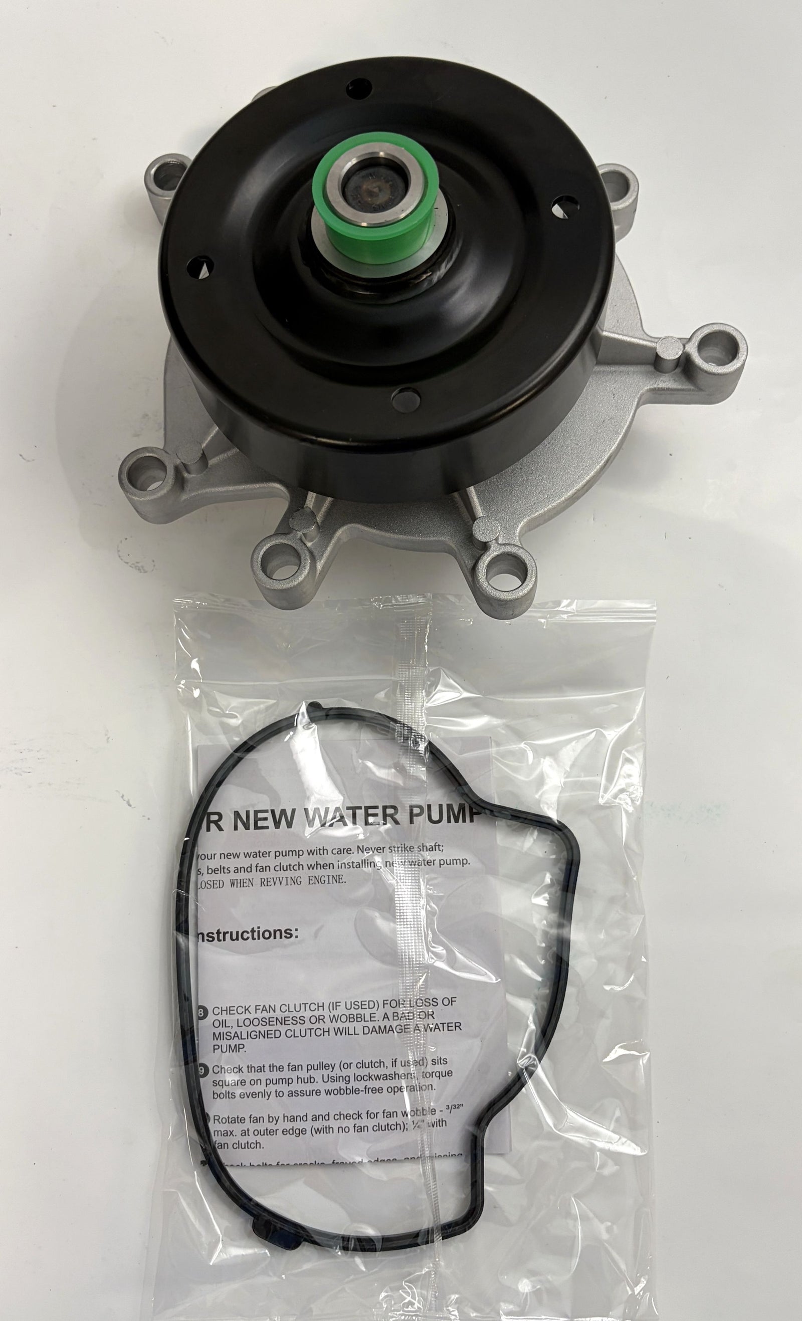 NAPA engine water pump with metal impeller and gasket, designed for automotive use, displayed on a white surface with installation instructions included.