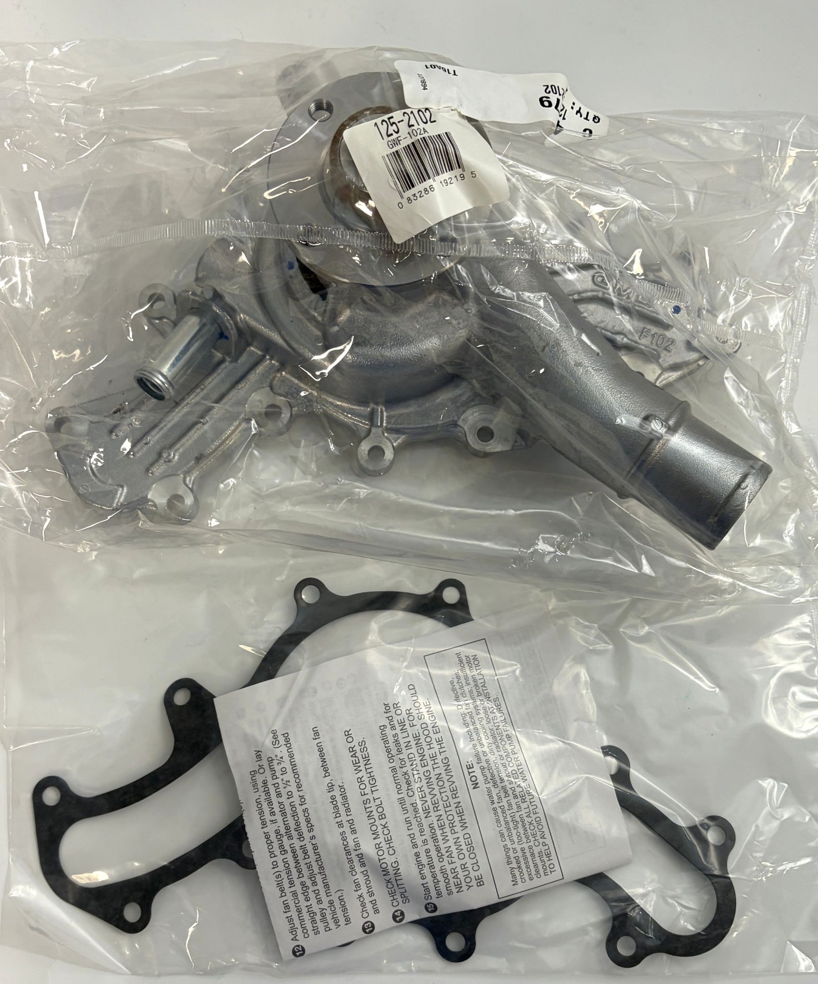 NAPA engine water pump with gasket sealed in clear plastic packaging, suitable for automotive repair and replacement.