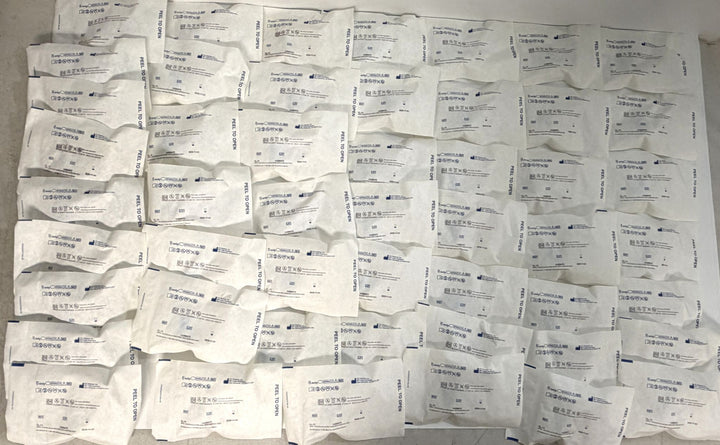 Multiple individually packaged ICU Medical ChemoLock CL-13 bag spikes with additive port, arranged in rows on a flat surface, new and sterile medical supplies for clinical use.