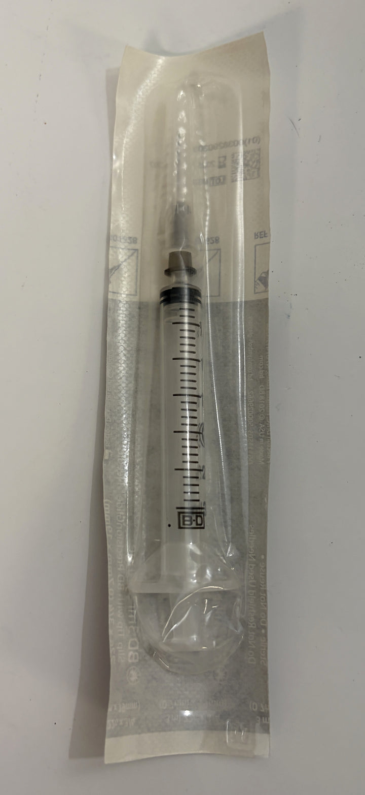 BD 3 mL luer-slip syringe with attached 22G needle in sealed sterile packaging for educational or non-clinical training use