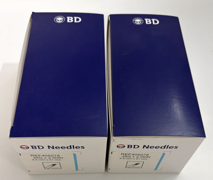 Two blue and white BD Spinal Needles boxes labeled Reference 405078, 25 gauge by 2 inch sterile medical needles