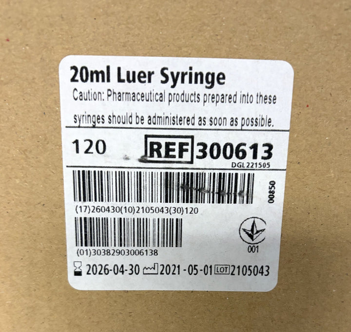 BD 20mL Luer Syringe box label showing 120 count, reference 300613, barcode, pharmaceutical caution, and manufacturing and expiration dates