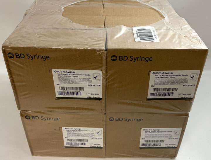 Stack of four brown cardboard boxes wrapped in clear plastic, each labeled as BD Syringe containing 3mL syringes with 22G needles for veterinary and training use.