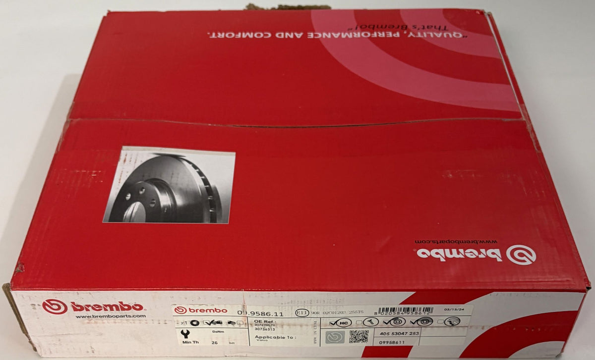 Red Brembo automotive brake component box featuring a brake disc illustration and printed identification labels