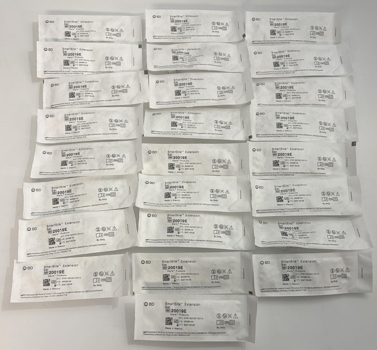BD 20019E SmartSite smallbore extension sets in individually sealed medical packages, arranged together for healthcare use