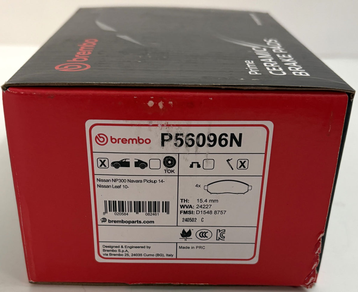 Red and black Brembo P56096N ceramic brake pad packaging labeled for Nissan NP300 Navara and Nissan Leaf, with printed specifications