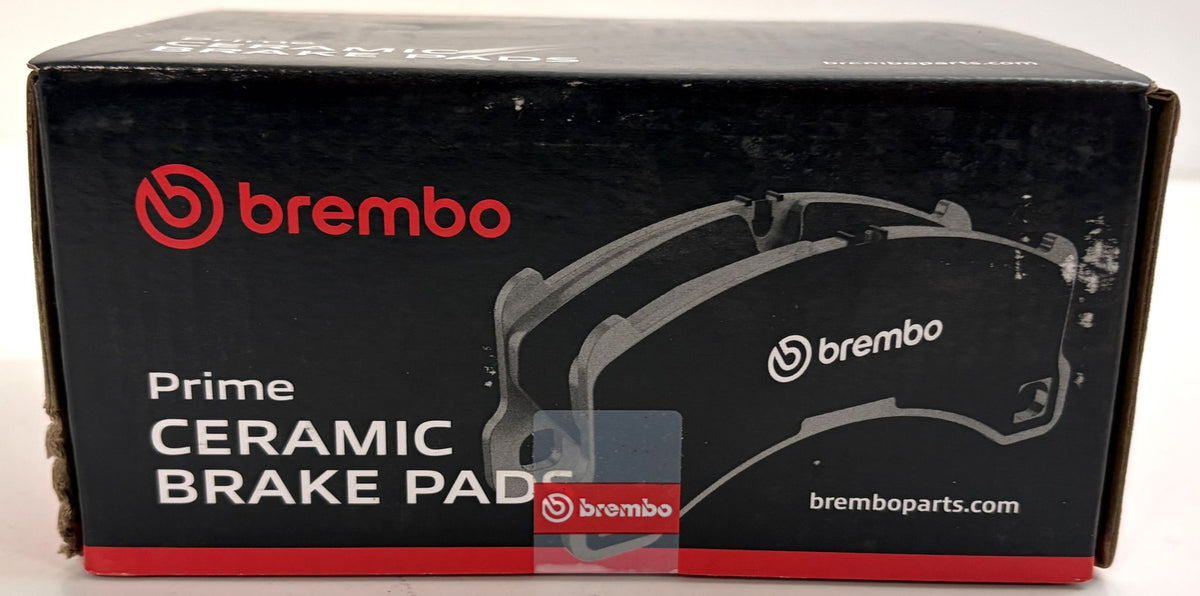 Brembo Prime Ceramic brake pad box in black and red packaging, showing a front brake pad illustration for automotive brake systems