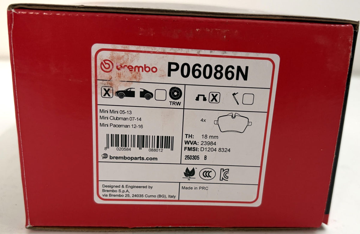 Red Brembo automotive brake pad box labeled P06086N, with Mini model compatibility details and a brake pad illustration.