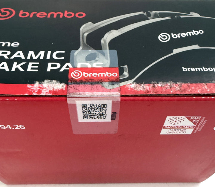 Brembo ceramic brake pad packaging with red and black box design, Brembo logos, QR code, and paper recycling label