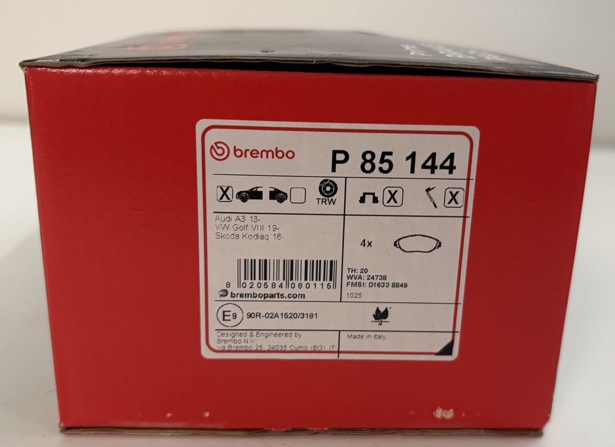 Brembo P85144 low metallic front brake pad set in red packaging, with an application label for Audi A3 and Volkswagen Golf models