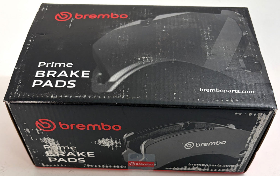 Brembo P85144 Prime low metallic front brake pad set box for Audi A3 and VW Golf VIII, with black packaging and visible scuffs