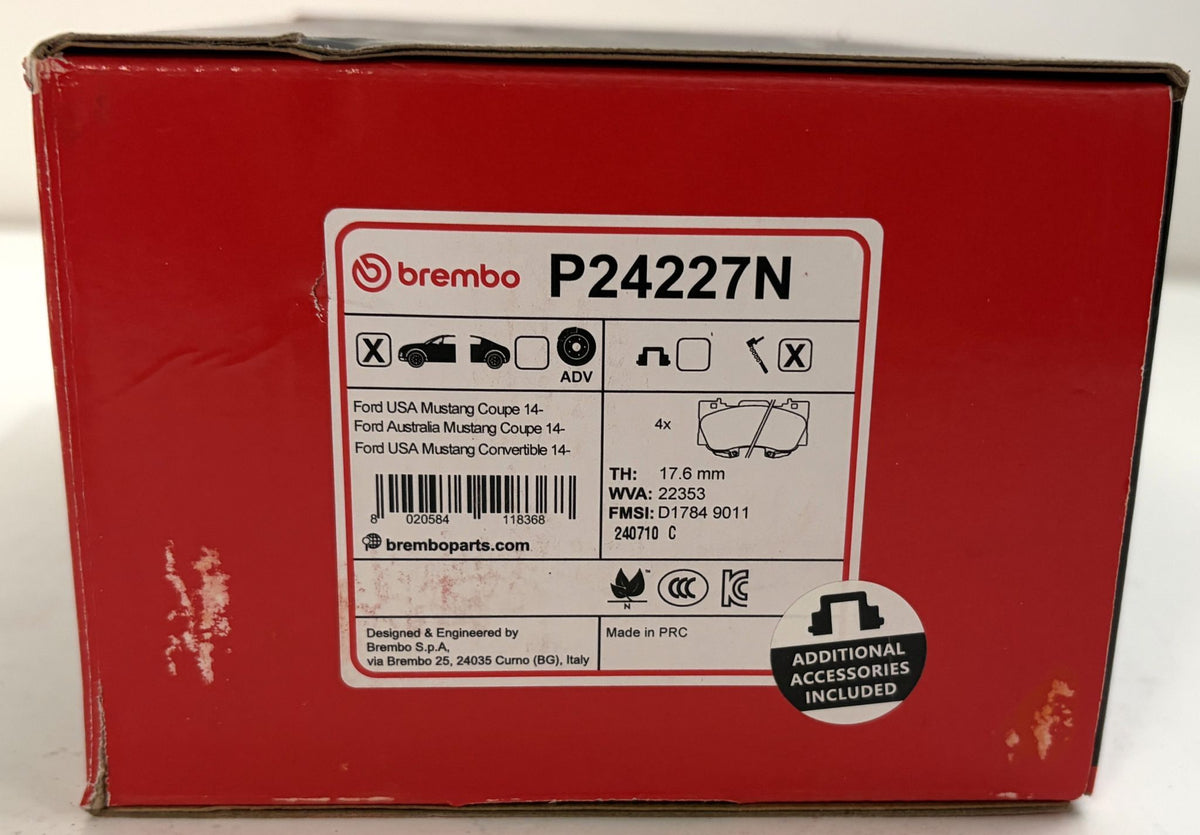 Red Brembo P24227N Prime Ceramic front brake pad box for Ford Mustang, featuring a compatibility label and additional accessories included badge