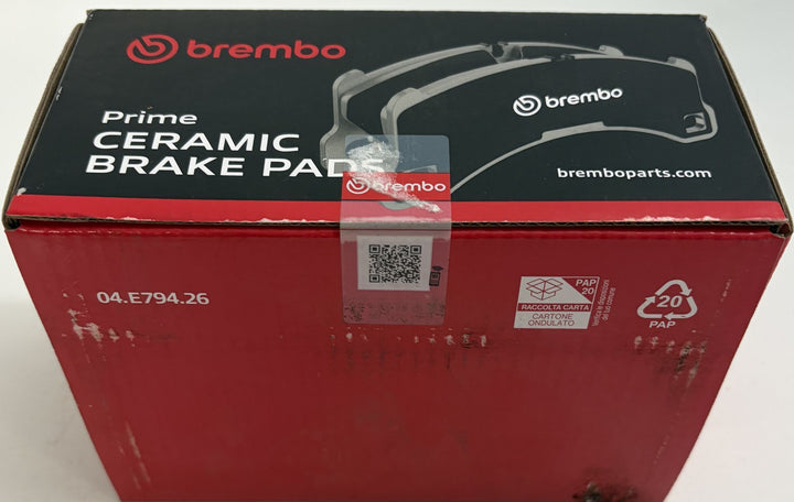 Brembo Prime Ceramic brake pad box in red and black packaging, marked 04.E794.26 with brake pad graphics and QR code