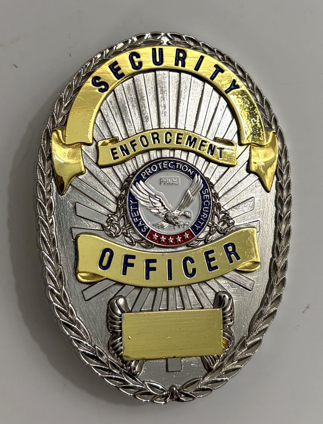 Security enforcement officer badge with eagle emblem on a gray background