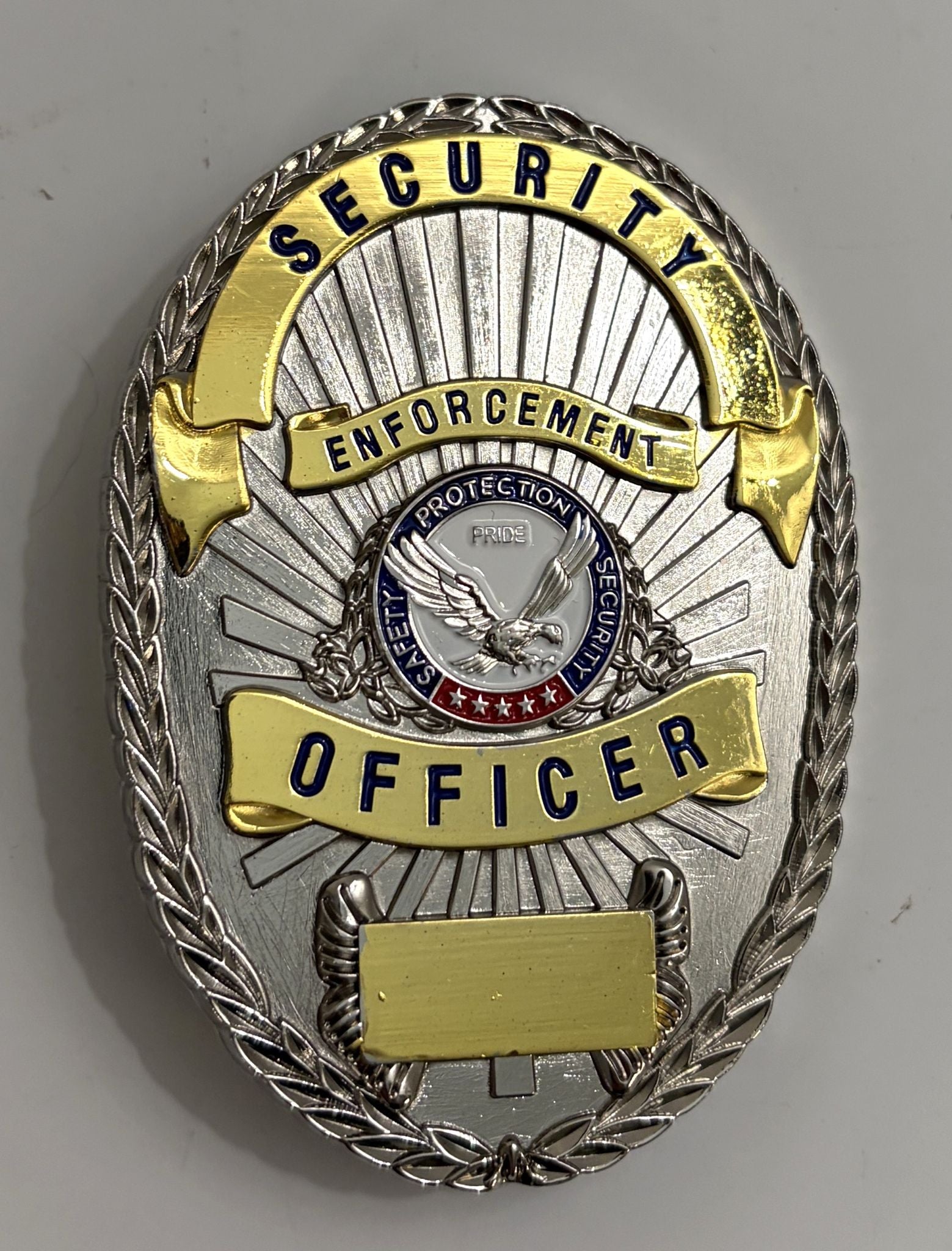 Security enforcement officer badge with eagle emblem on a gray background