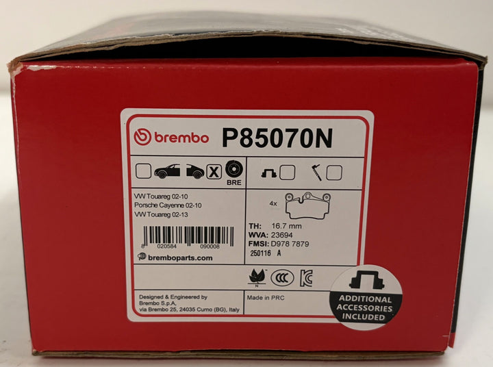 Red Brembo P85070N automotive brake pad box labeled for VW Touareg and Porsche Cayenne applications, with additional accessories included label