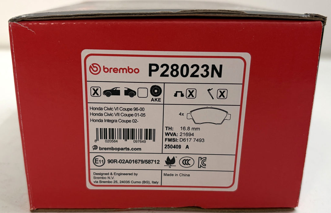 Brembo P28023N ceramic front brake pad set in a red box, labeled for Honda Civic and Integra models.