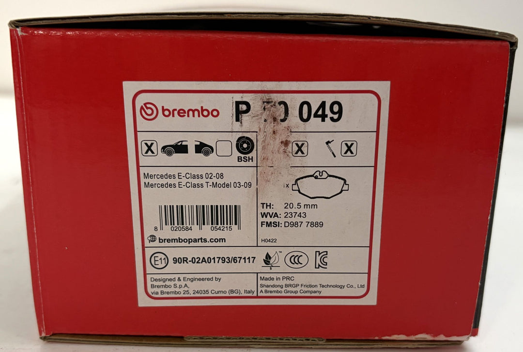 Red Brembo P50049 brake pad box labeled for Mercedes E-Class W210 and W211 models, with pad diagram and automotive part details