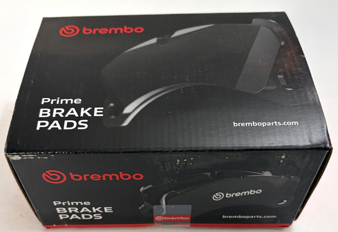 Brembo Prime P50049 low metallic front brake pad set in sealed black and red automotive packaging for Mercedes Benz E Class