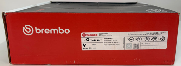 Red Brembo automotive parts box with a white product identification label and black lid sealed in branded packaging