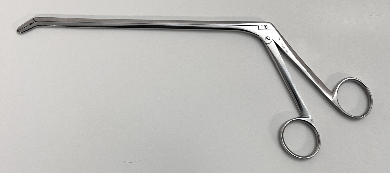 Pre-owned Codman Surgical Rongeur, Angle Down – precision bone-cutting tool for surgical procedures.