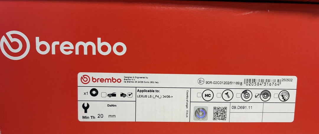 Red Brembo automotive parts box with a white compatibility label, brake component icons, barcode, and visible part number 09.D811.11