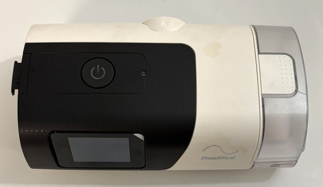Resmed AirSense 11 AutoSet CPAP machine in white and black with display and humidifier chamber pre owned medical equipment