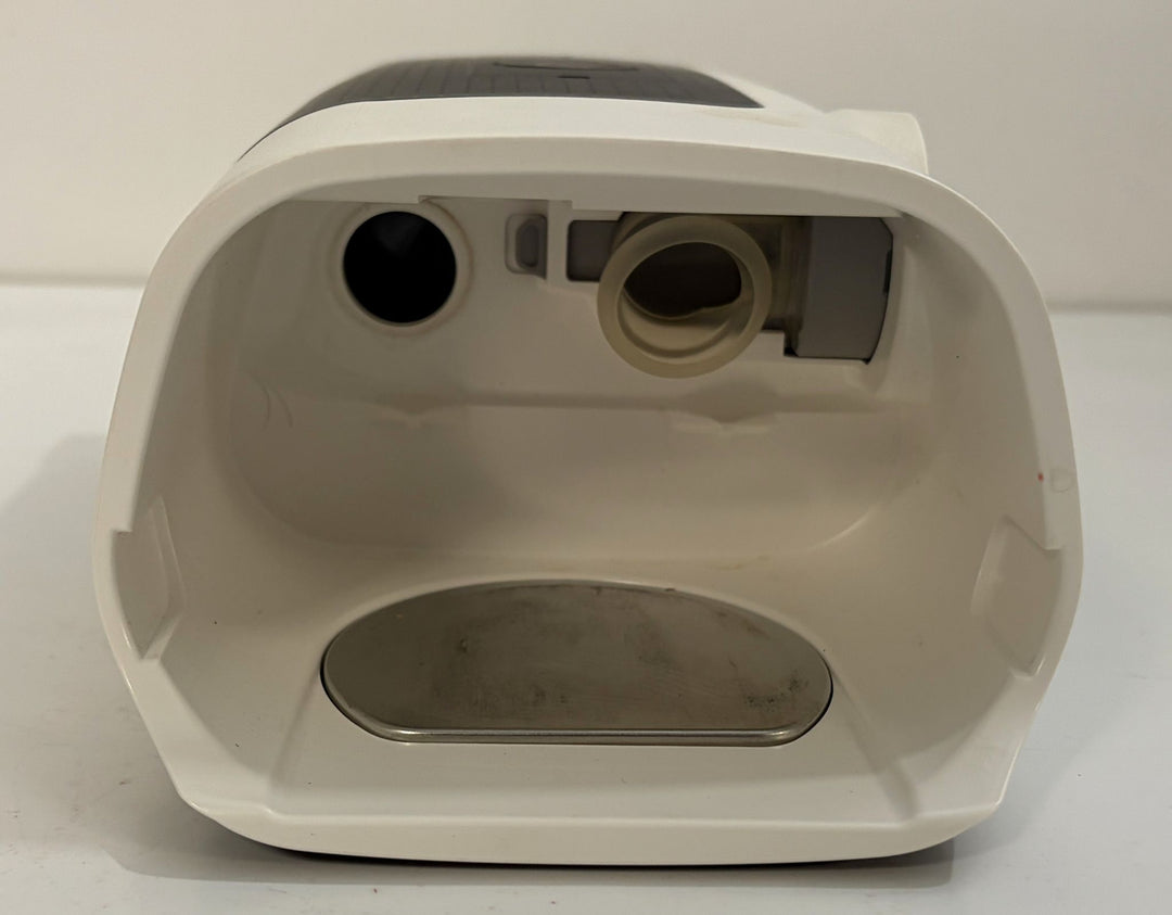 Pre owned ResMed AirSense 11 AutoSet CPAP machine in white with the humidifier chamber removed, showing the interior and connector ports for medical use