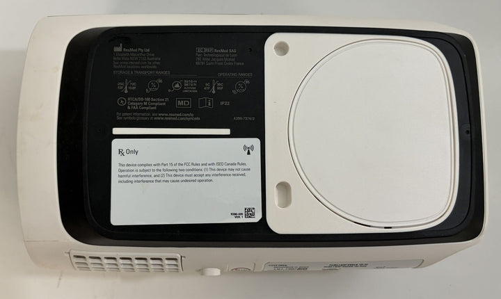 Resmed AirSense 11 AutoSet pre owned CPAP machine underside with black and white housing and identification labels for medical use