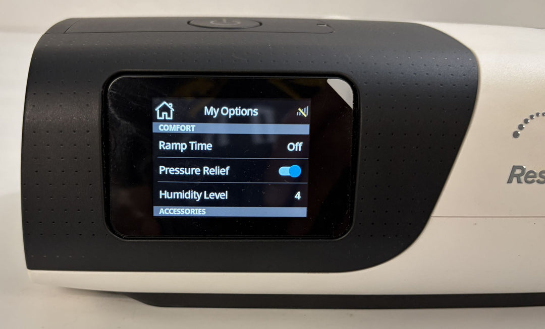 Pre-owned Resmed AirSense 11 AutoSet medical CPAP machine with touchscreen displaying comfort settings, ramp time, pressure relief, and humidity level