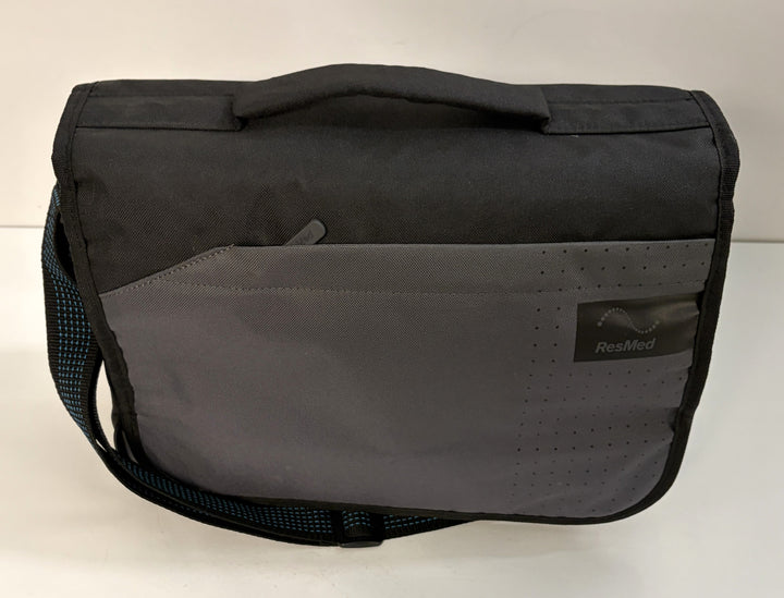 ResMed black and gray carrying case for AirSense 11 AutoSet medical CPAP equipment, pre-owned with shoulder strap and front pocket