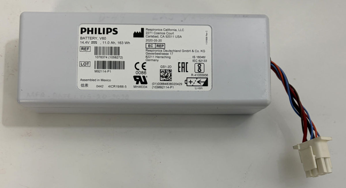 Philips medical battery pack in a white rectangular housing with a printed label and multicolored wires leading to a white connector