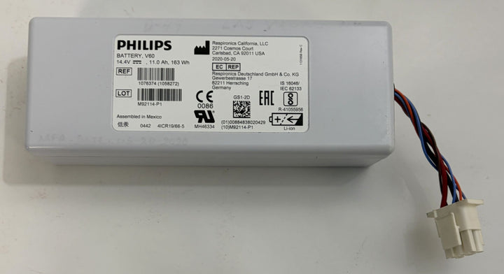 Philips medical battery pack in a white rectangular housing with a printed label and multicolored wires leading to a white connector
