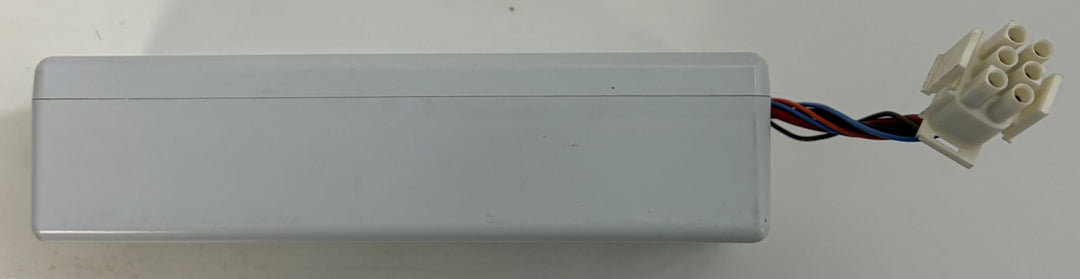 Gray rectangular electrical component with multicolored wires and a white multi pin connector on a light background