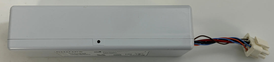 Long gray plastic electrical enclosure with exposed red, black, and blue wires leading to a white connector