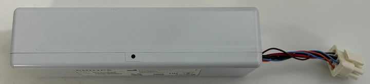 Long gray plastic electrical enclosure with exposed red, black, and blue wires leading to a white connector