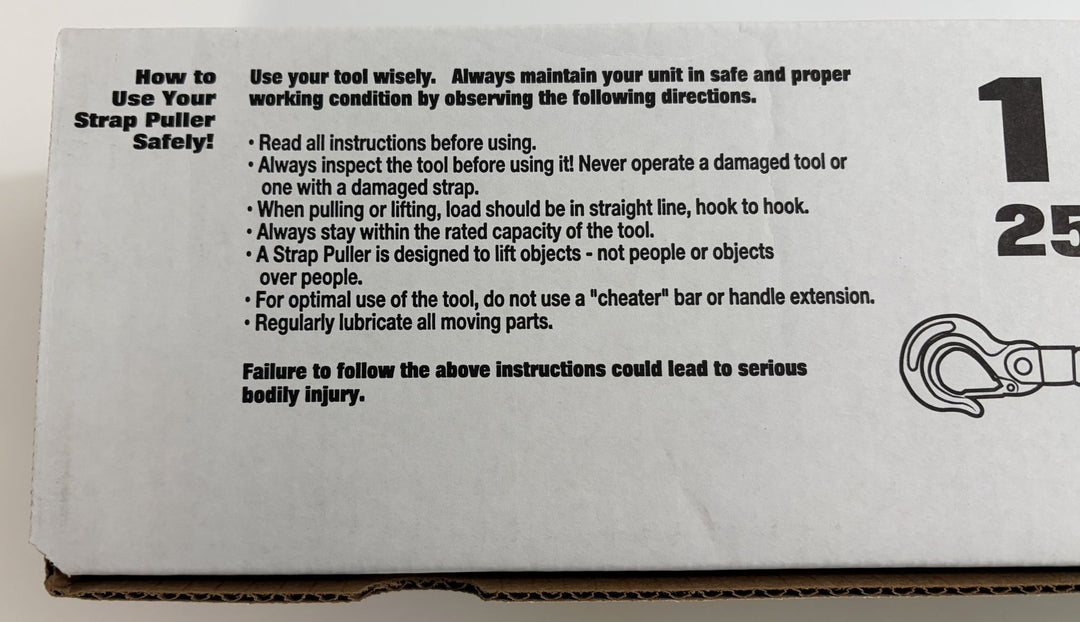 Maasdam strap puller packaging with printed safety instructions, warning guidance, and a partial line drawing of the tool on cardboard.