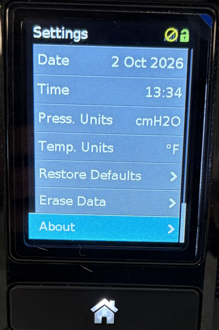 Resmed AirSense 10 AutoSet CPAP console displaying the Settings menu with date, time, cmH2O pressure units, temperature units, and About option