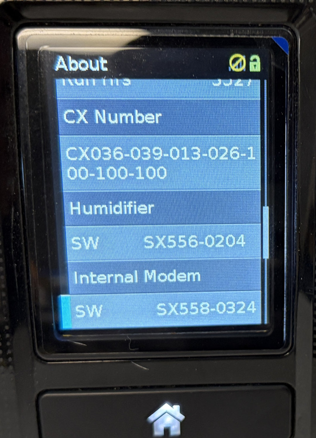 Resmed AirSense 10 AutoSet CPAP console with powered-on About screen showing CX number, humidifier, and internal modem software details