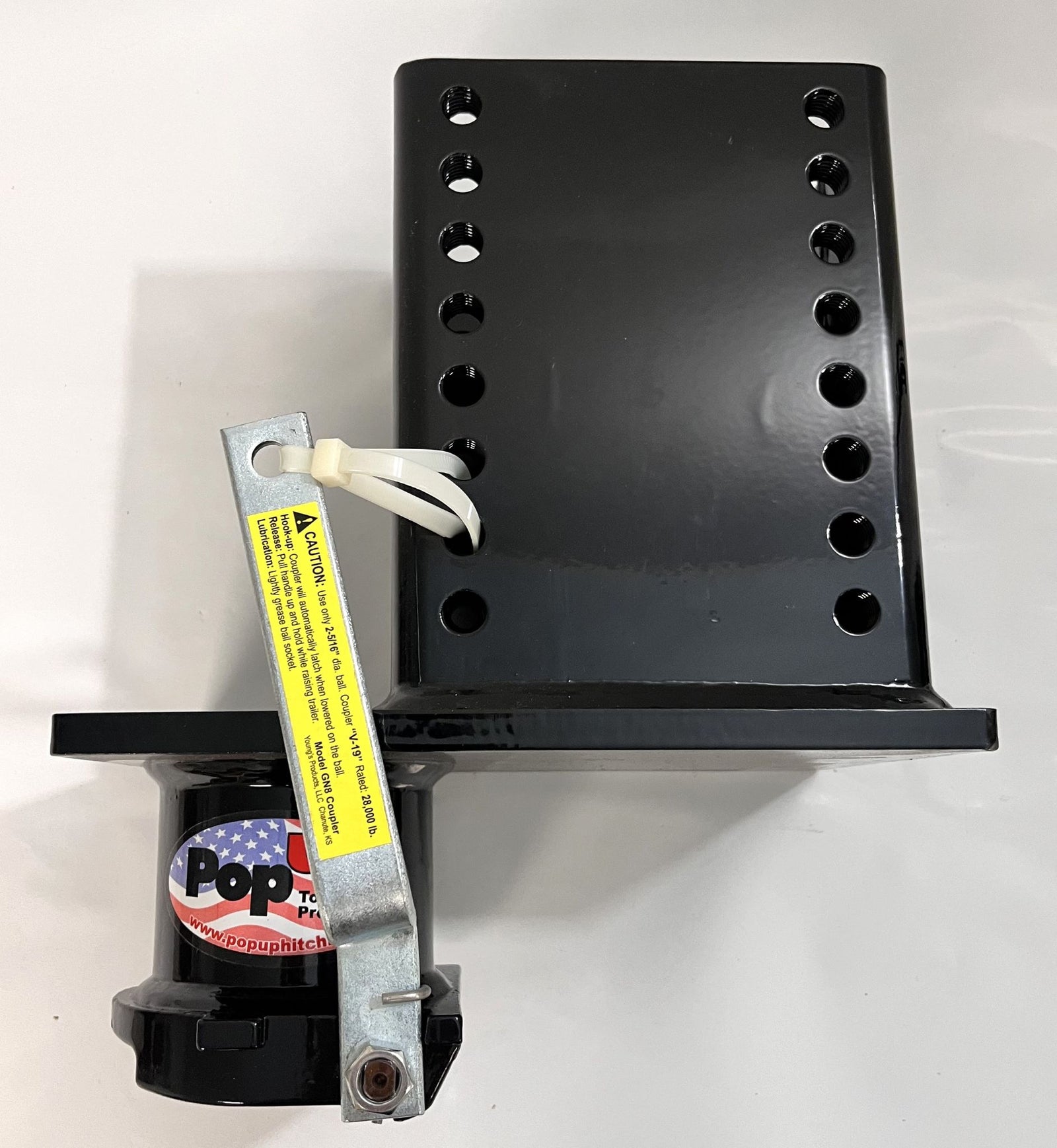 A black fifth wheel adapter lower unit with gooseneck for RVs, featuring multiple mounting holes and a yellow warning label with the brand 'Popup'.